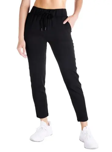 Yogipace Petite Women's 7/8 On The Fly Pants in black, showing a tapered ankle fit.