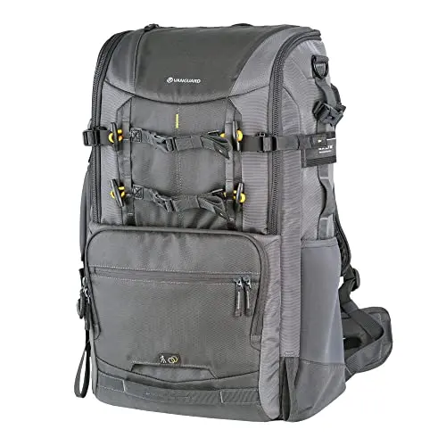 VANGUARD Alta Sky 68 camera backpack with multiple openings, shown holding a large telephoto lens
